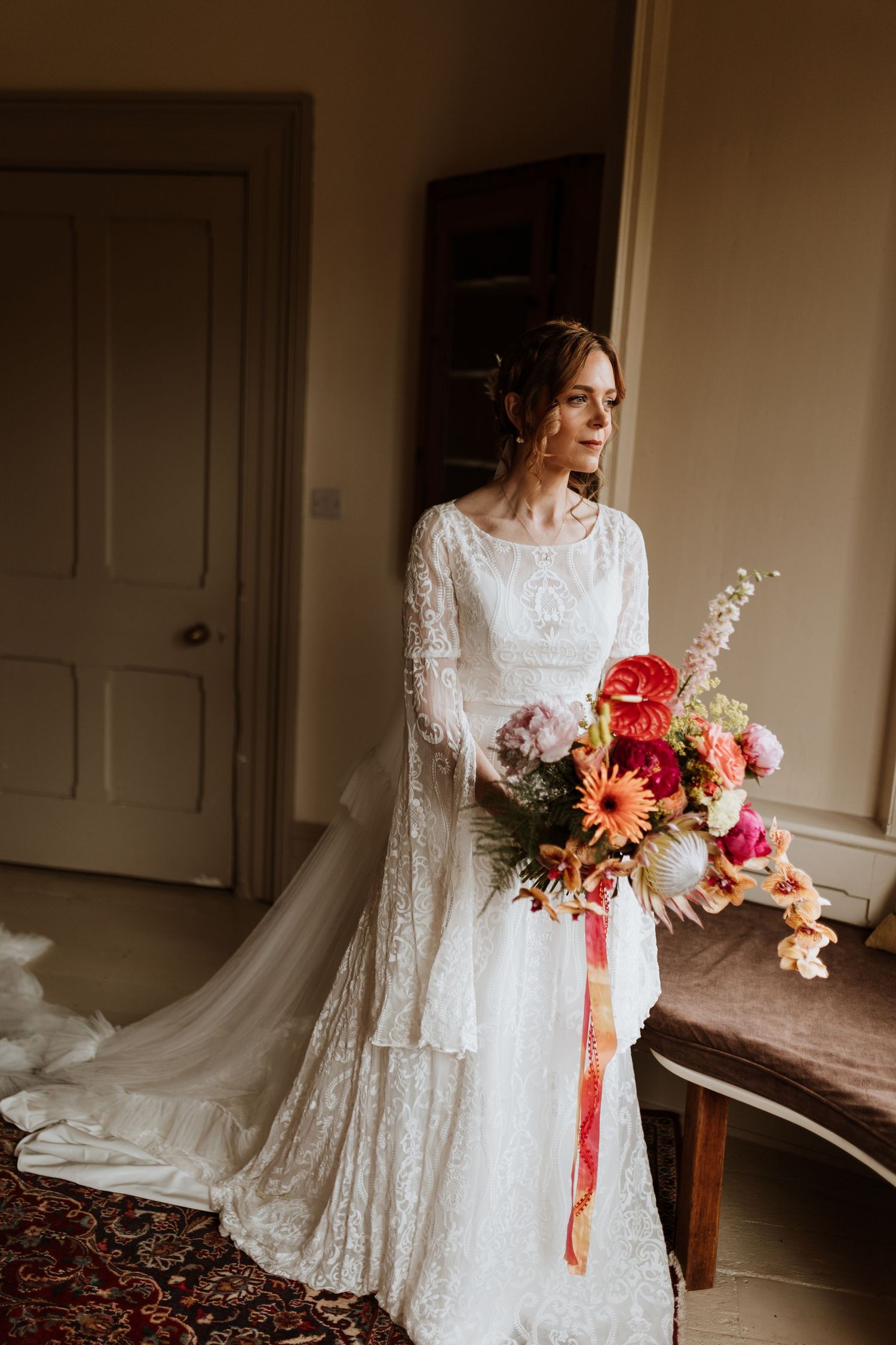A series of four romantic bridal photos featuring a white lace dress and colorful floral bouquet in a rustic interior setting.