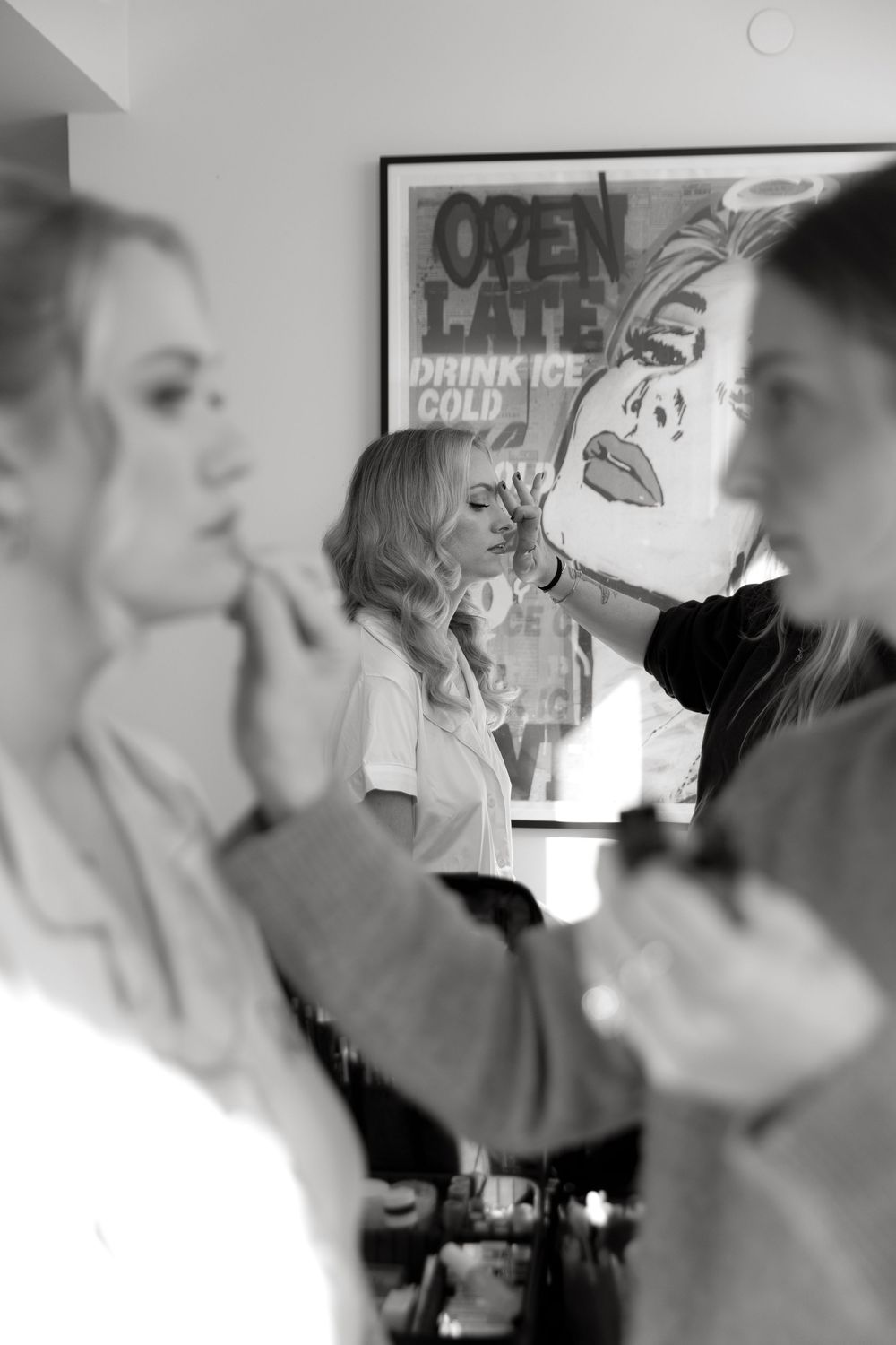 A series of black and white photographs showing people conversing across what appears to be a bar or counter.