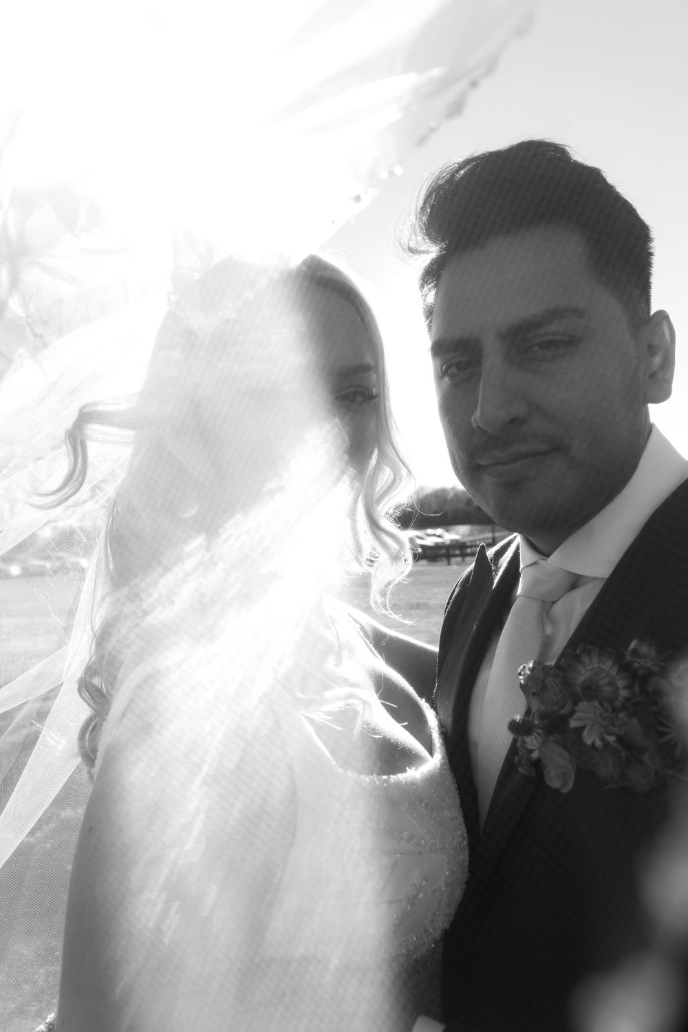 A black and white series of candid portraits featuring formal attire and floral boutonnieres at a special event.