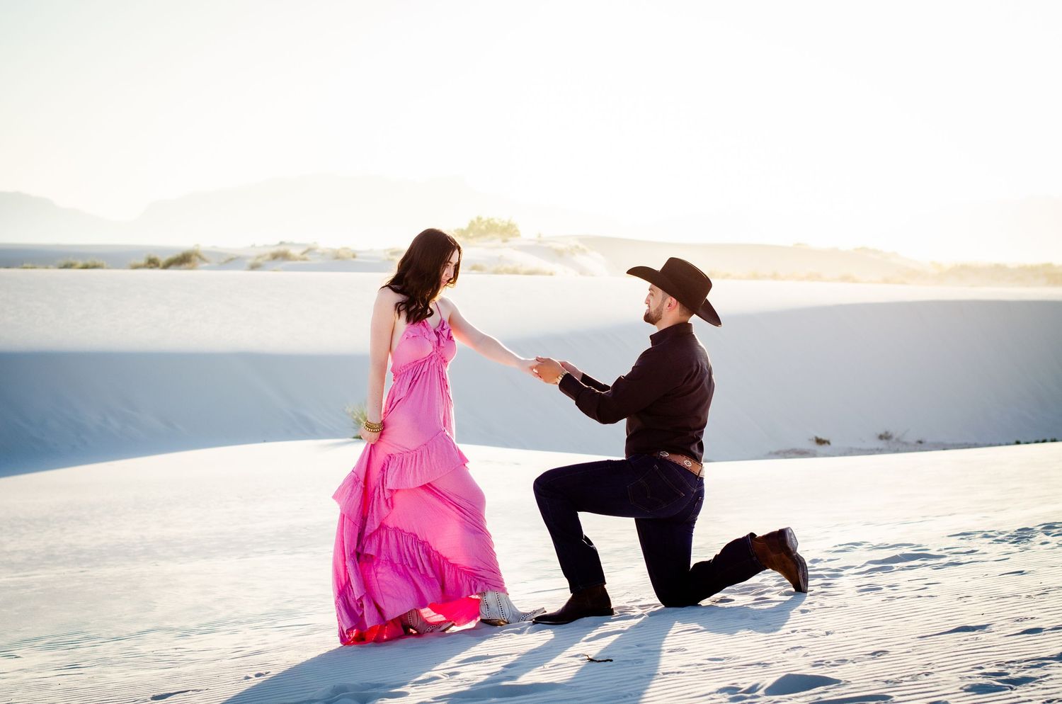 Two dancers in romantic pose on white sand dunes during sunset at White Sands National Park, New Mexico. Couples photoshoot Las Vegas