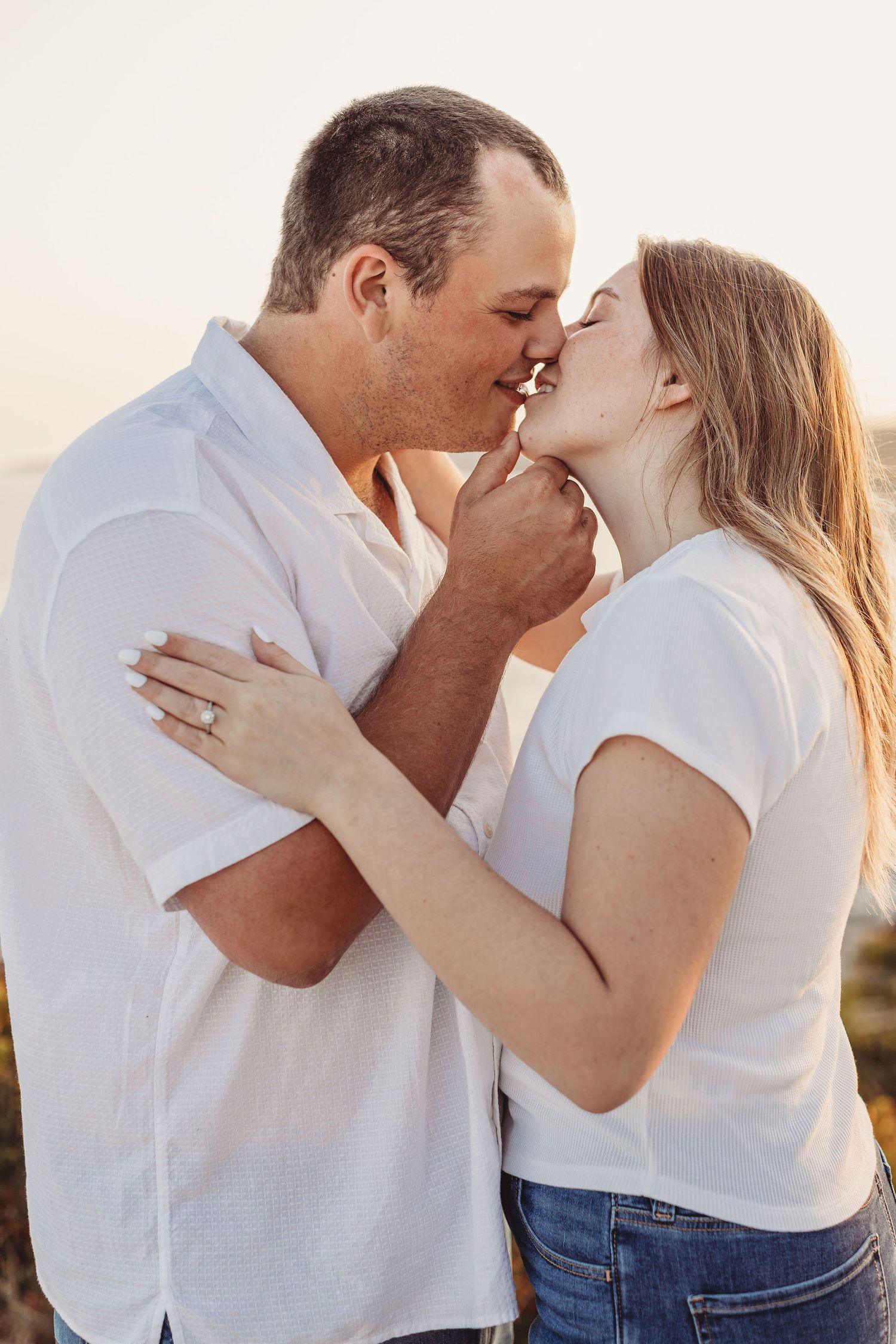Professional photo of a couple kissing on the beach