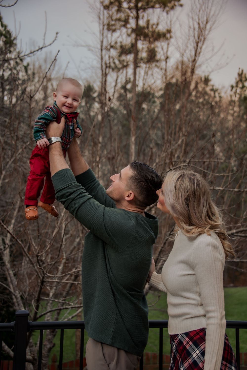 Young couple holding baby up Richmond, Virginia photograph