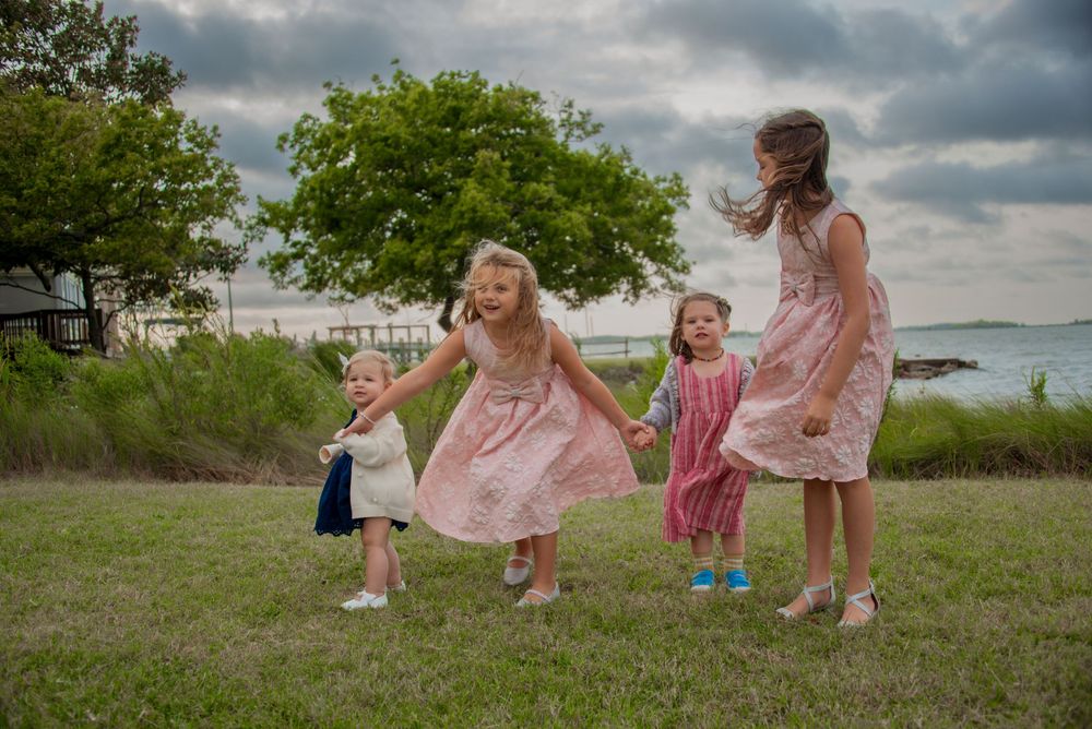 Group photo of young kids outdoors by the water