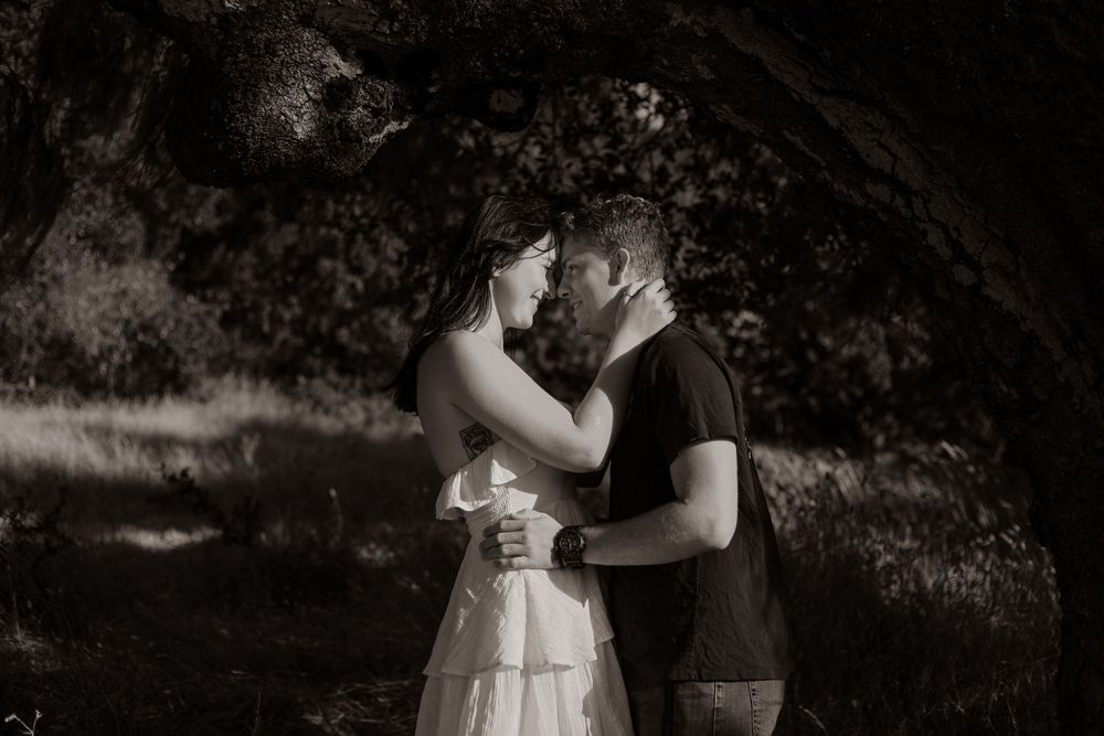Black and white wedding photos showing romantic moments and dance poses between couple in formal attire.