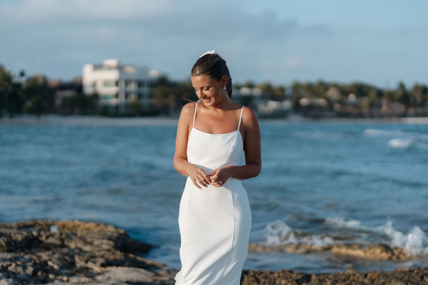 Editorial bridal portrait during golden hour with ocean views in Riviera Maya, Mexico.