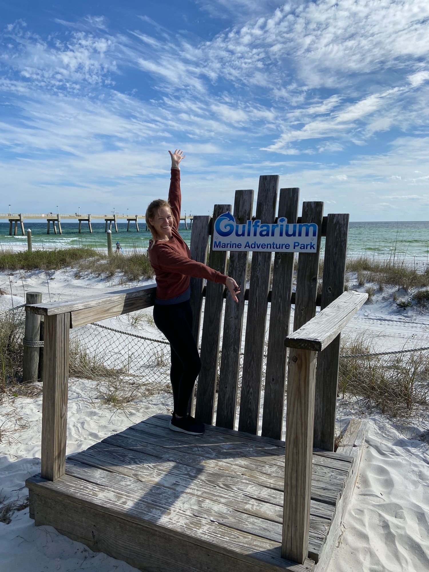 Woman standing at the Gulfarium Marine Adventure Park overlooking the Gulf of America in Destin Florida
