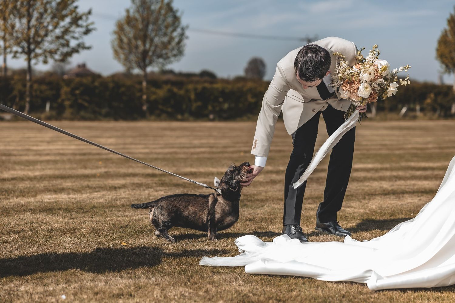 A natural wedding moment at Beverley barn when the couples dog arrived for some couple portraits.