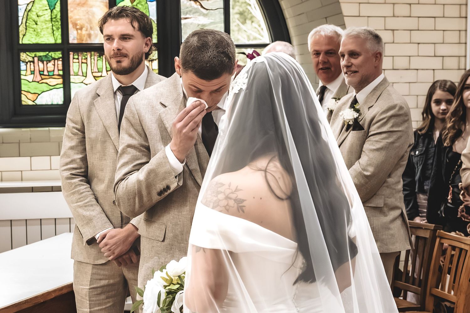 An emotional groom moment as the groom sees his bride on their wedding ceremony.