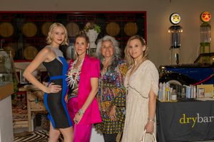 Group portrait captured at Club Auto Vino during a luxury California event by Raymond C. Hansell Photography.