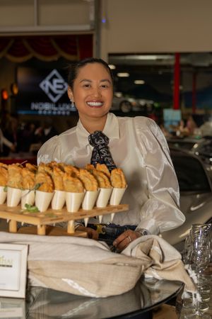 Luxury event detail featuring guests and catering at Club Auto Vino photographed by Raymond C. Hansell Photography.