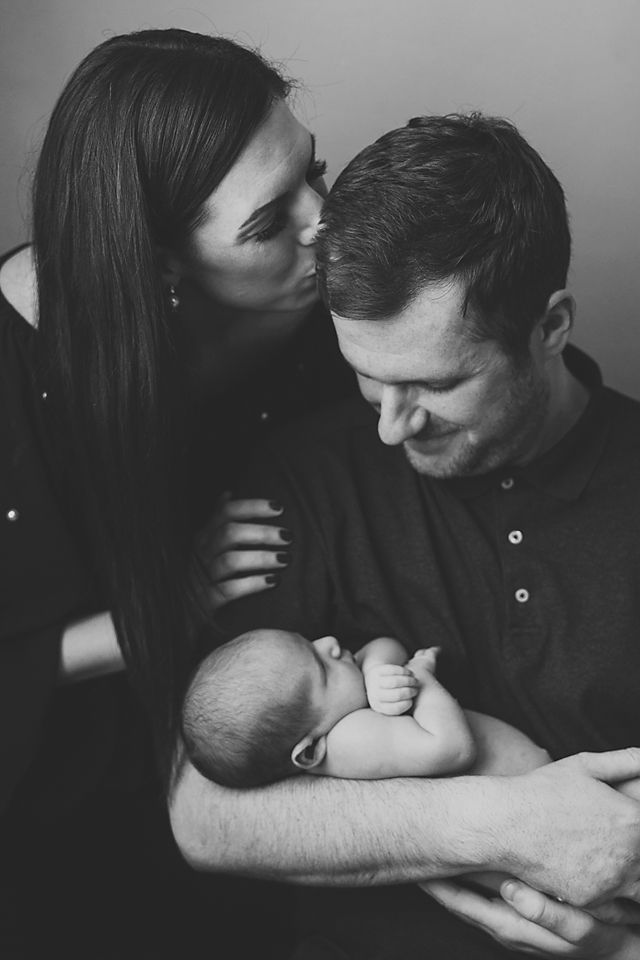 Black and white series showing parents sharing quiet moments with their newborn.