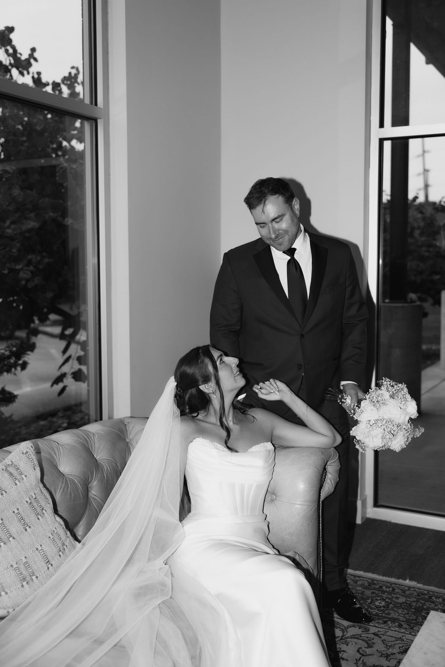 Intimate black and white wedding portraits showing tender moments between newlyweds.
