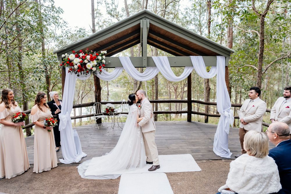 Wedding ceremony collage showing outdoor forest venue with white drapery and guests in soft pink dresses.