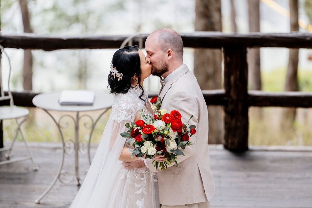 Romantic outdoor wedding photos featuring bride and groom embracing in a rustic forest setting.