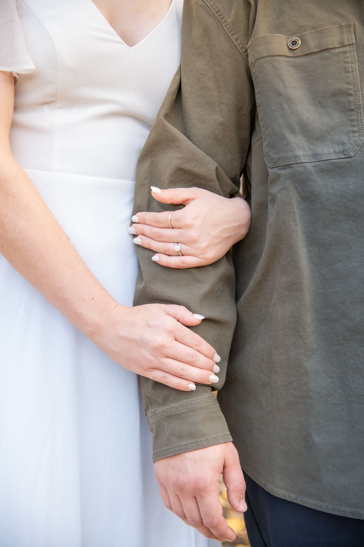 detail photo of ring and hands during engagement session in Vail Colorado