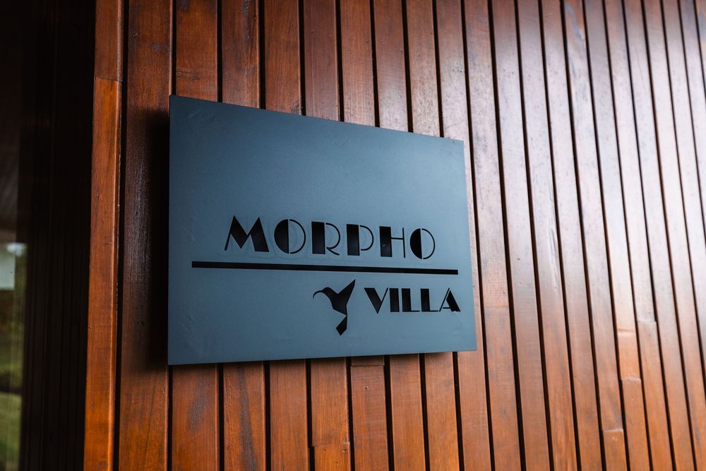 Modern signage on wooden wall panels in contemporary cabin design.