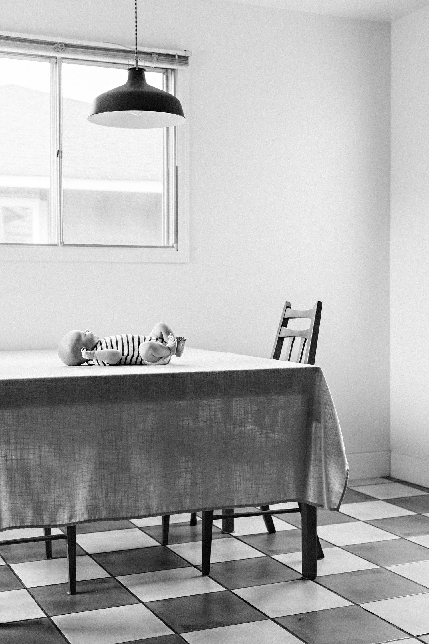 newborn baby in kitchen