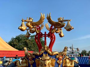 Gold moose-shaped decorative lamp post design in front of the Magic Kingdom park at Walt Disney World.