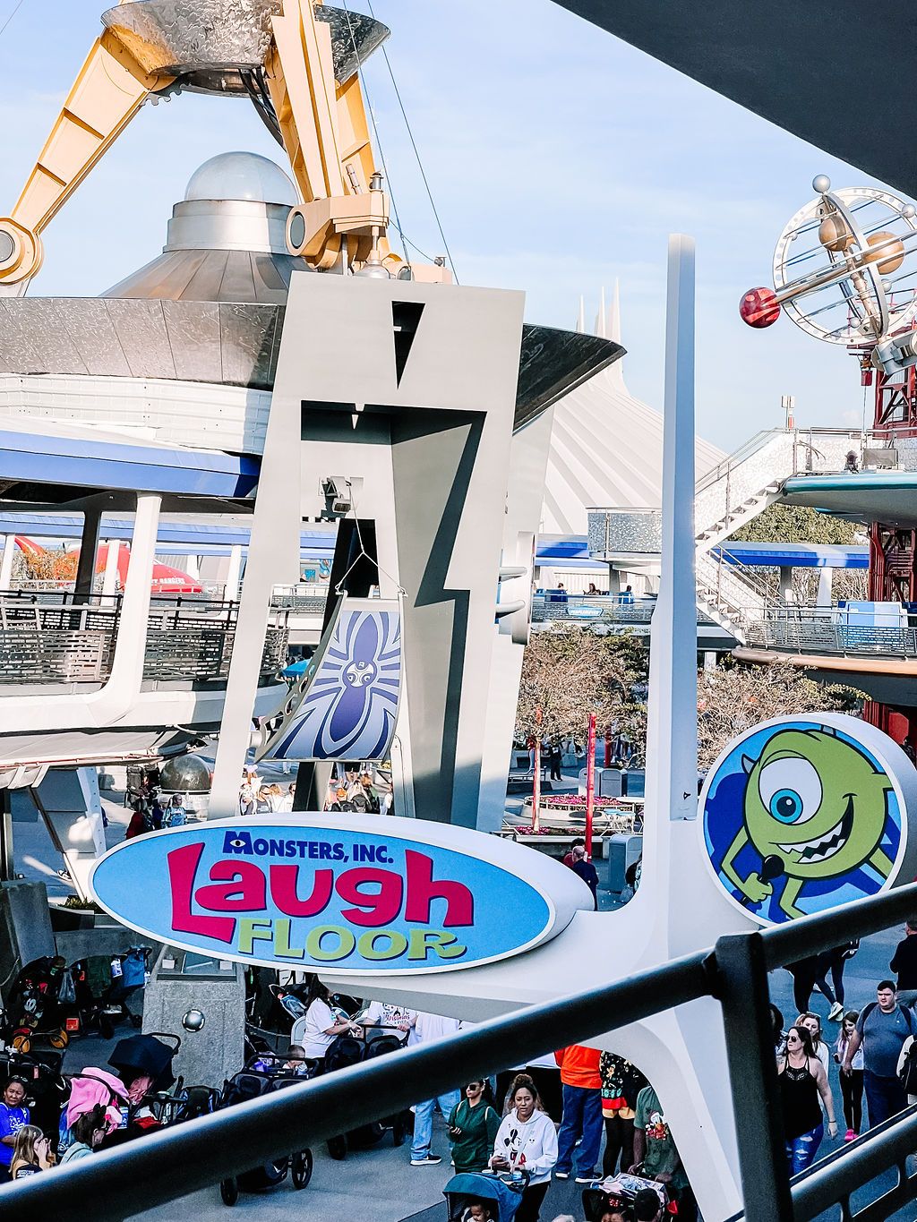 Disney's Monsters Inc Laugh Floor attraction entrance sign at Tomorrowland in Magic Kingdom theme park.