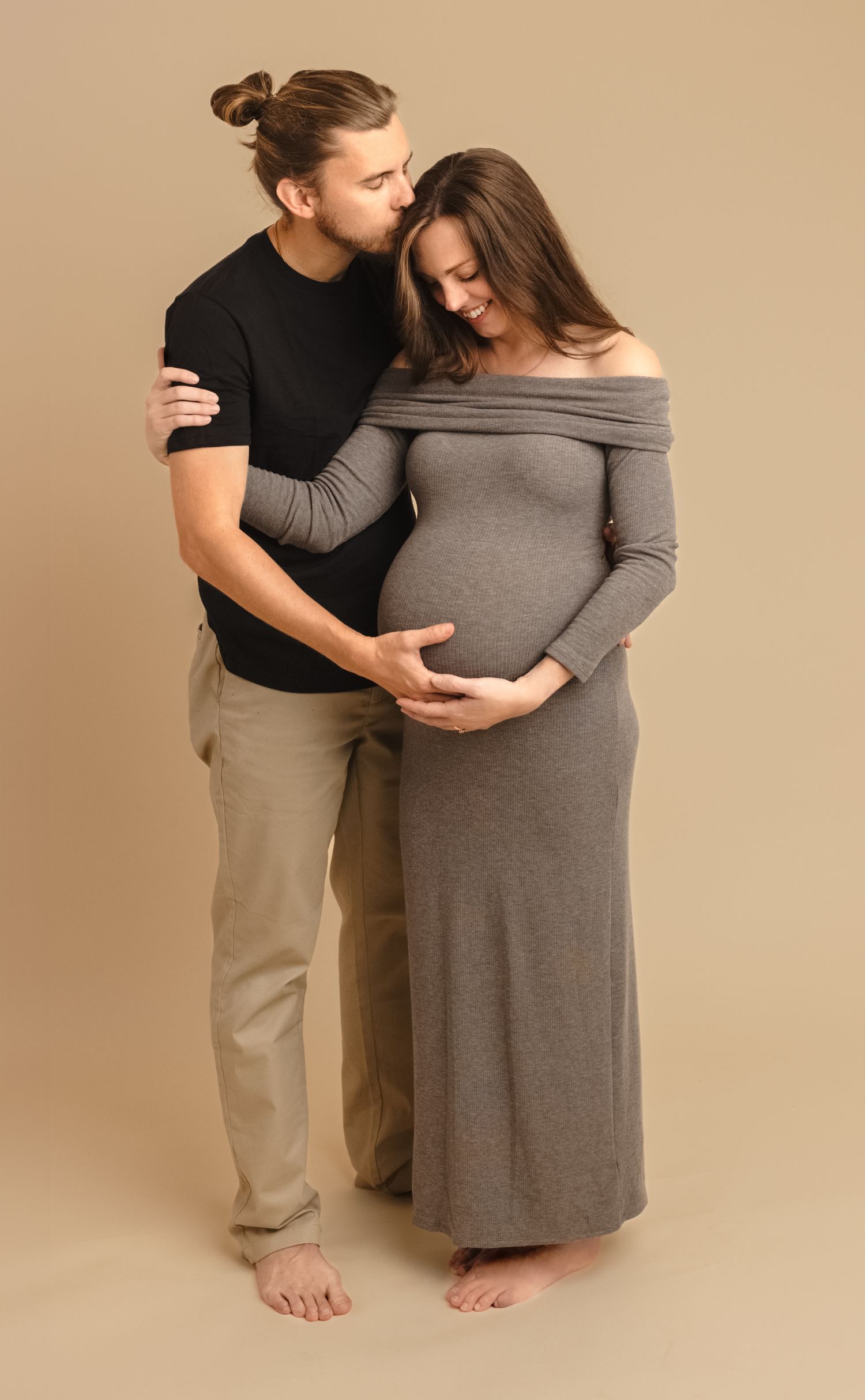 Charlottesville photographer, maternity, newborn, family, and baby, husband kissing wife's head and hugging during a maternity session.
