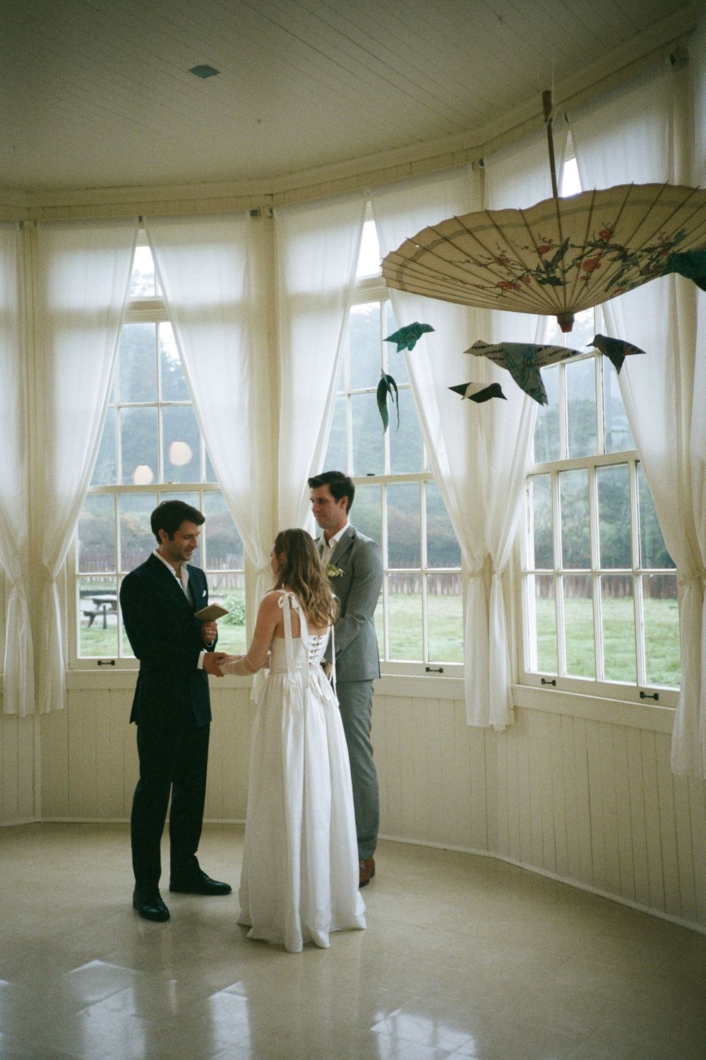 Dance practice in a bright circular room with large windows and natural lighting.