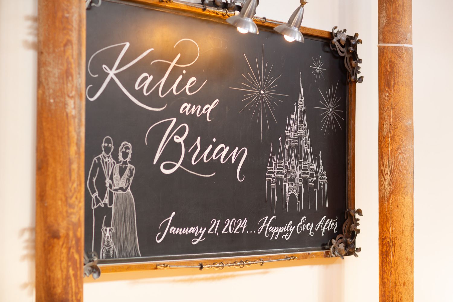 Rustic wedding chalkboard sign with castle illustration and couple's names.