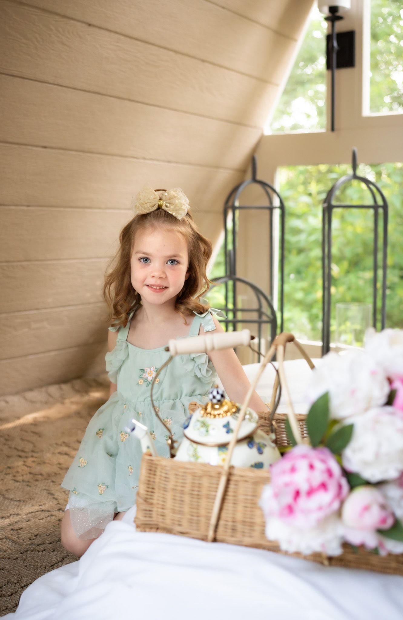 Dreamy indoor portraits with pink peonies and wicker baskets in a bright sunlit space.