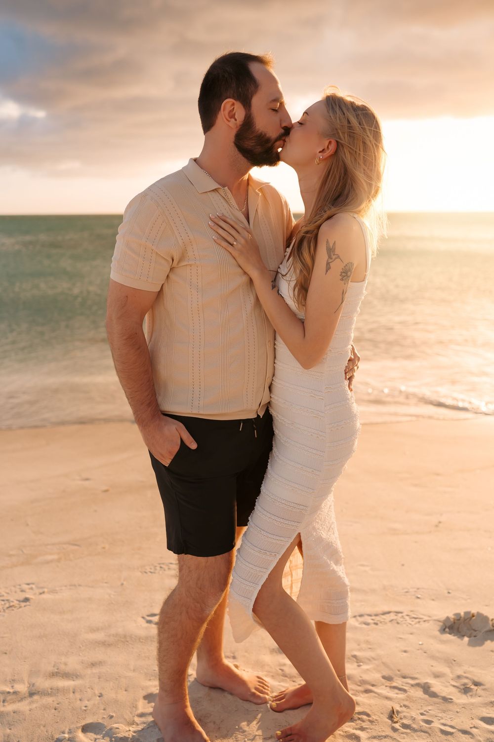 Joyful proposal moment during a sunset photoshoot on the Gulf Coast