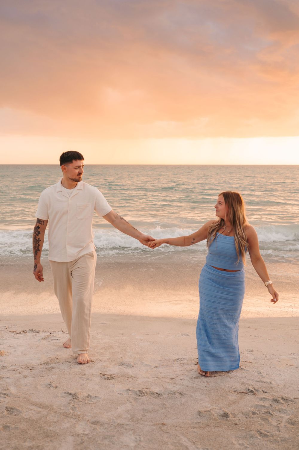 Sarasota beach engagement session during sunset photography shoot
