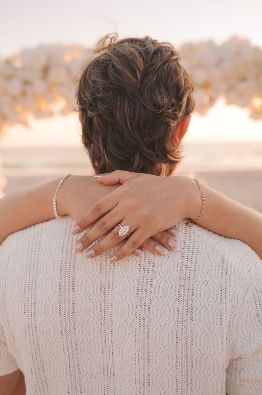 Close-up of diamond engagement ring in coastal light