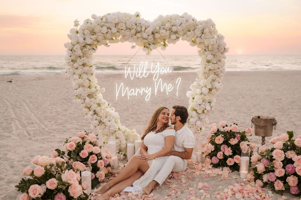 Surprise proposal captured during a golden hour beach photography session in Florida