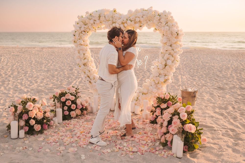Emotional “yes” moment during a sunset engagement session on the beach