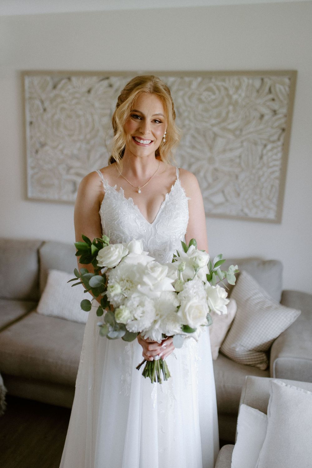 A serene bridal preparation scene with white floral bouquet and elegant decor.