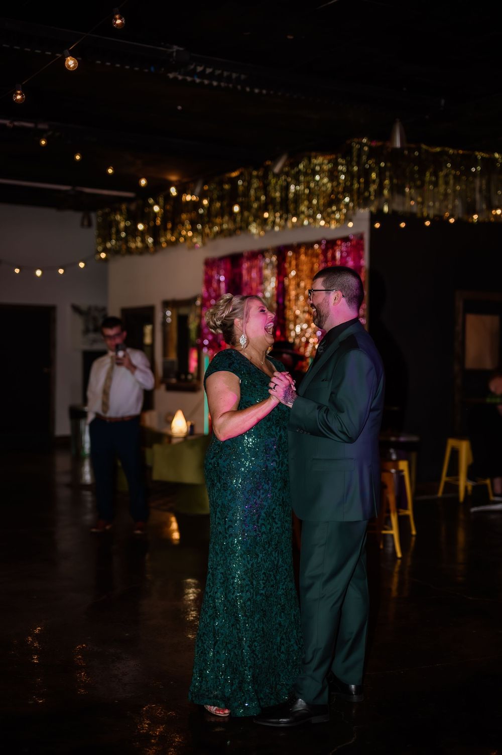 Mother/Son slow dancing under twinkling lights at an evening reception in Toledo, Ohio.