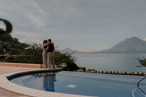 Infinity pool overlooking mountain landscape and ocean views.