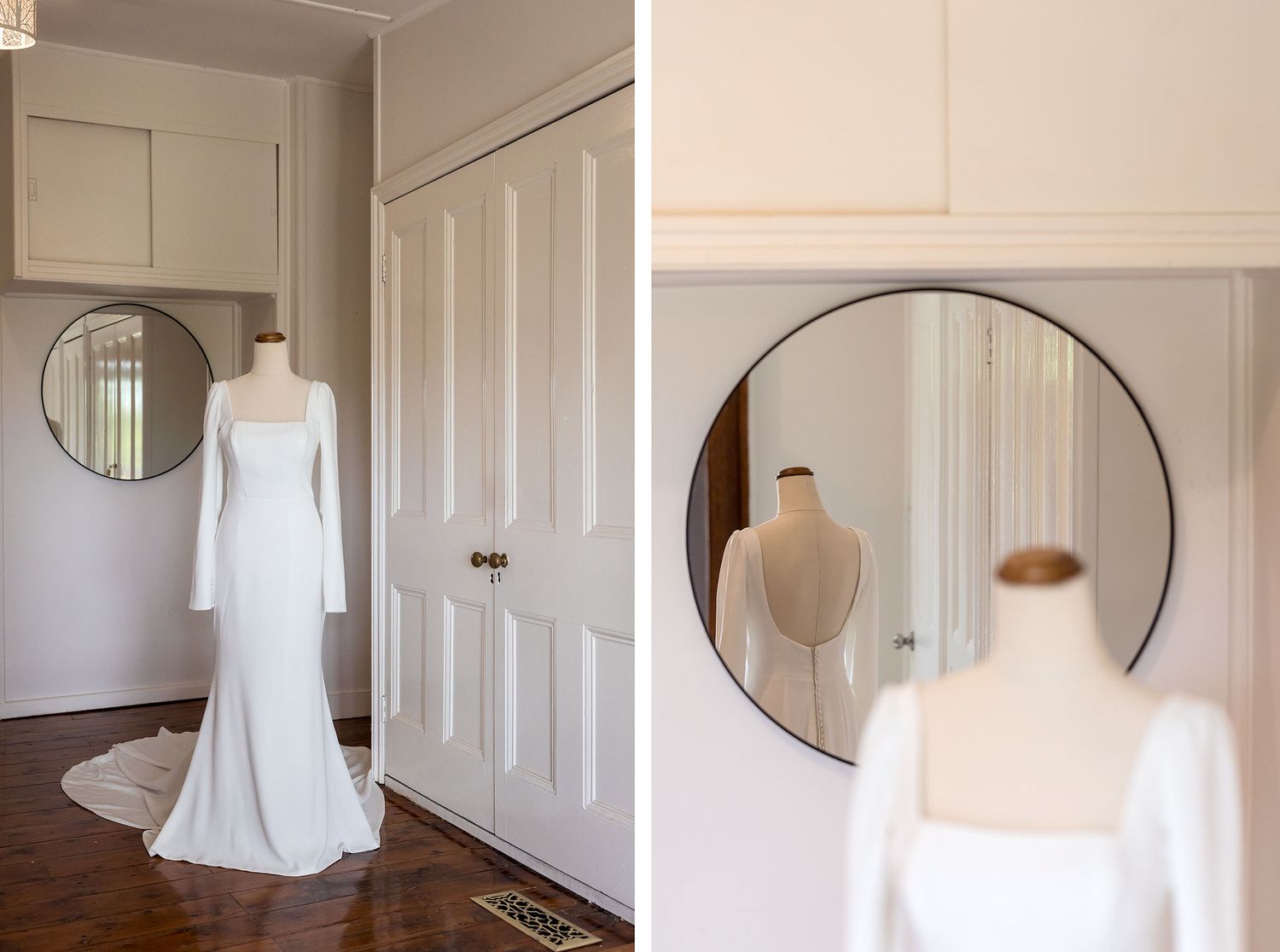 A minimalist white wedding dress with long sleeves displayed in a room with round mirrors and white doors.