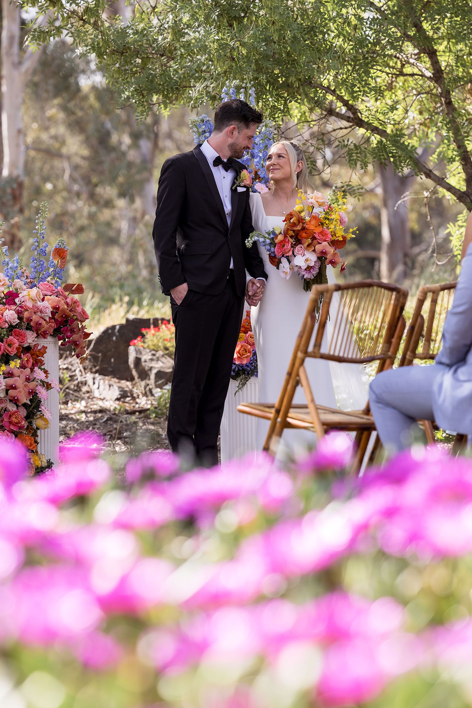 A Bride and Groom share a moment during their wedding vows during their outdoor wedding ceremony at the Balldale Hotel.
