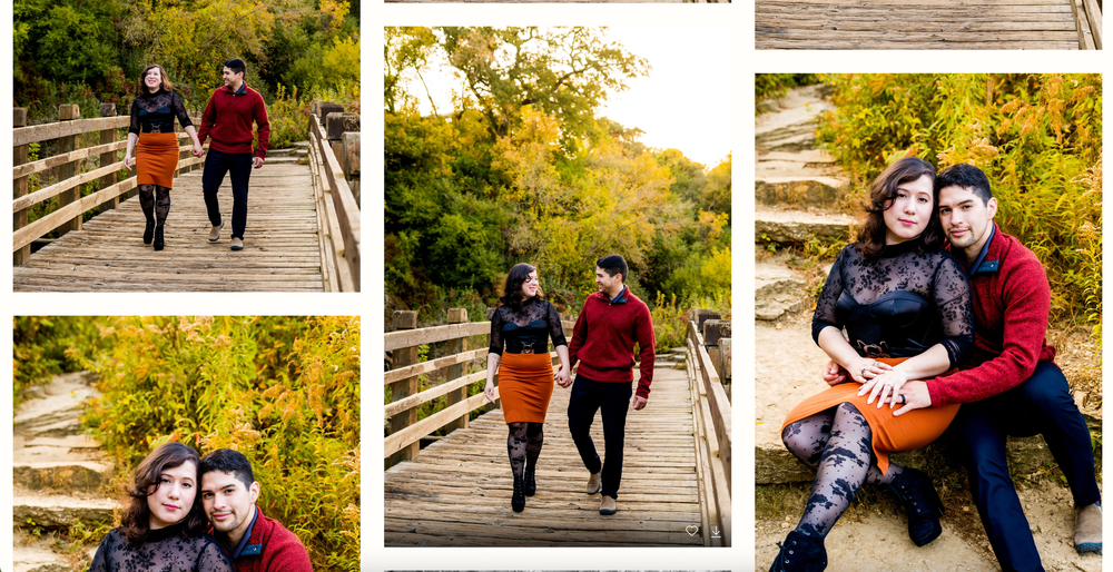 A couple walks hand in hand along a wooden boardwalk surrounded by autumn foliage and golden light.