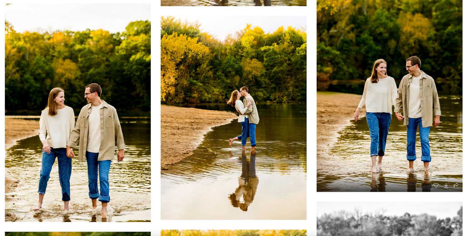 Couple in casual outfits walking together and splashing water along a scenic autumn shoreline at sunset.