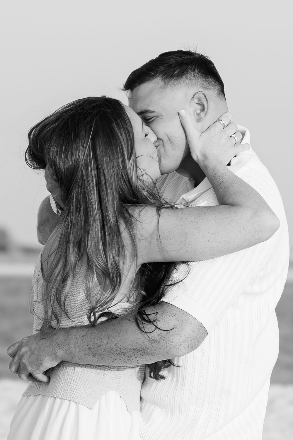 Black and white series showing an intimate moment between a couple celebrating their engagement.