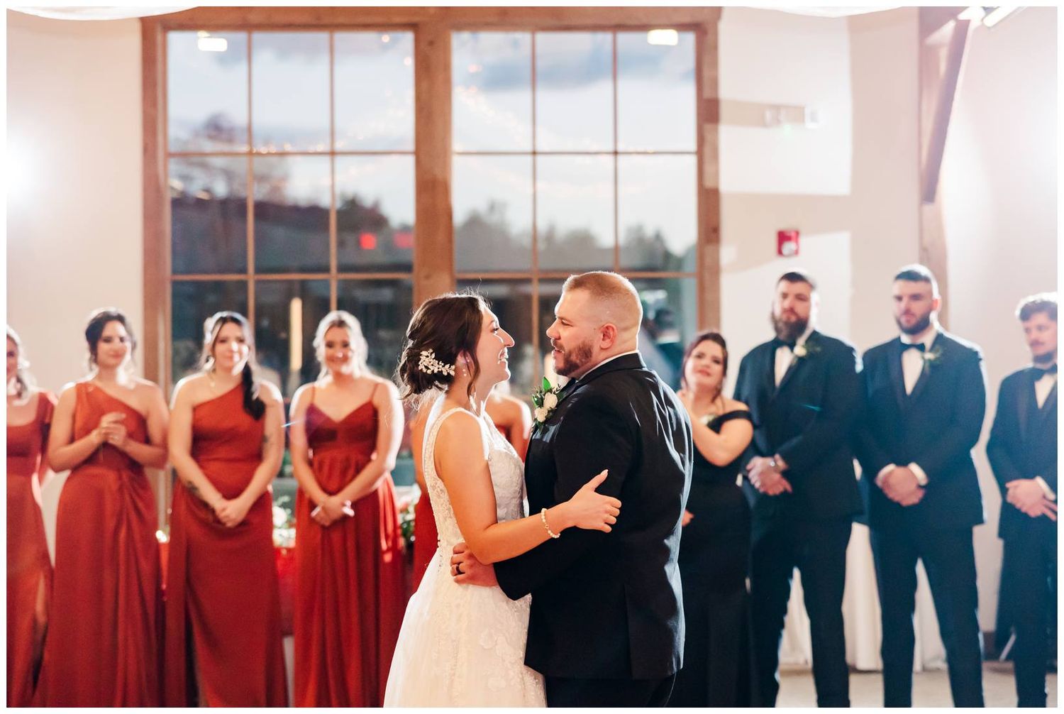 A collage of wedding photos showing a bridal party in red dresses and groomsmen in dark suits at an indoor venue.