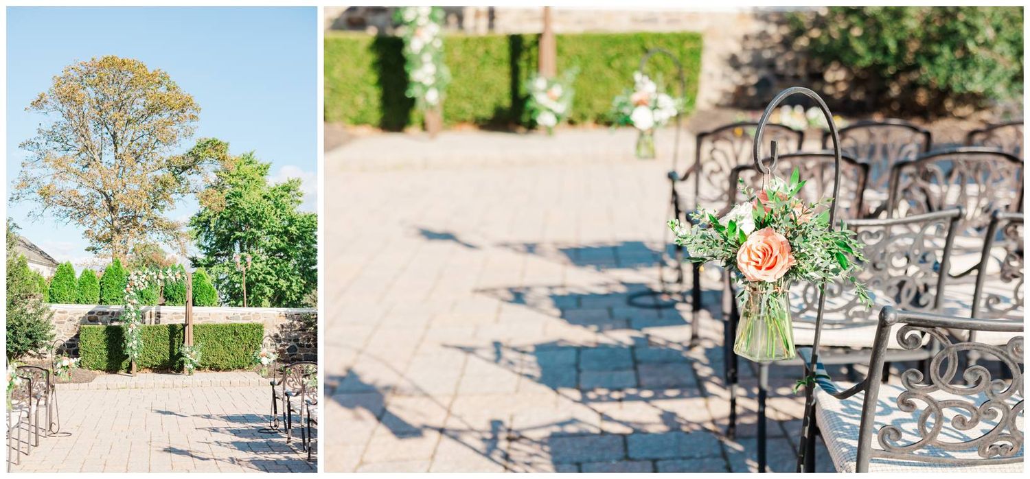Wedding ceremony setup with decorative metal chairs and floral arrangements in an outdoor garden setting.