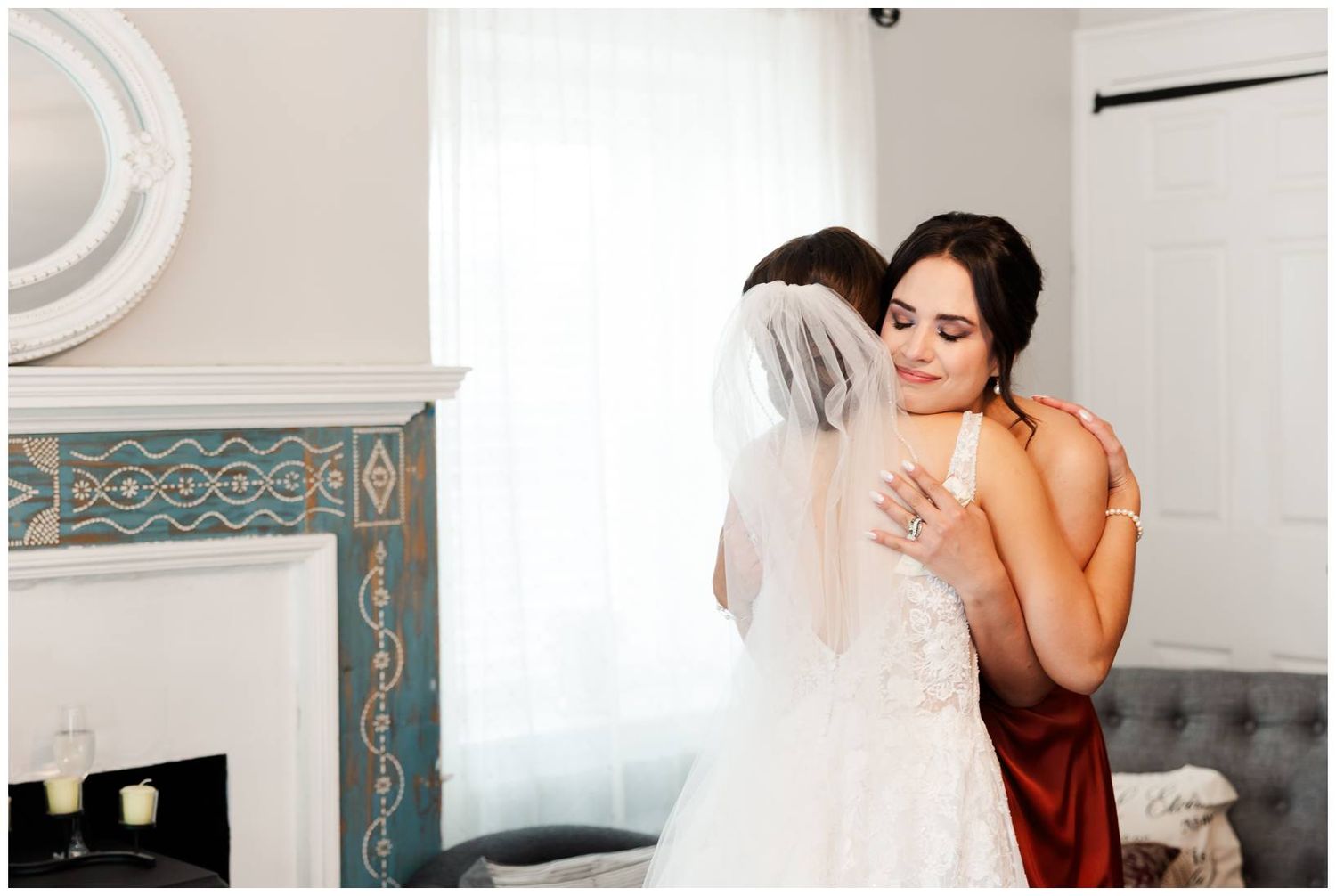 Bridal preparation scene in a bright room with teal accents and flowing white veil.