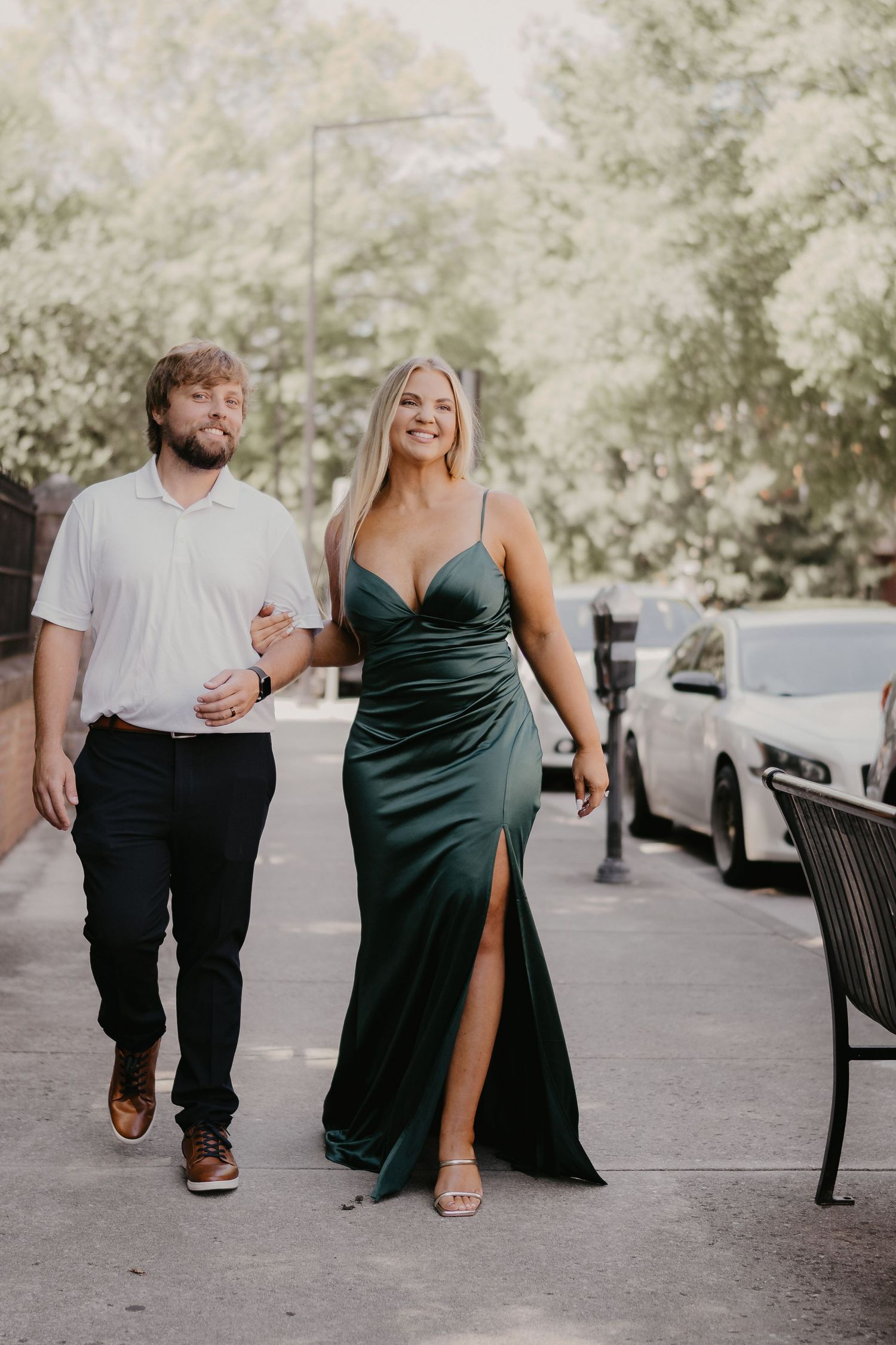 groom and bride walking down gay street after knoxville courthouse wedding