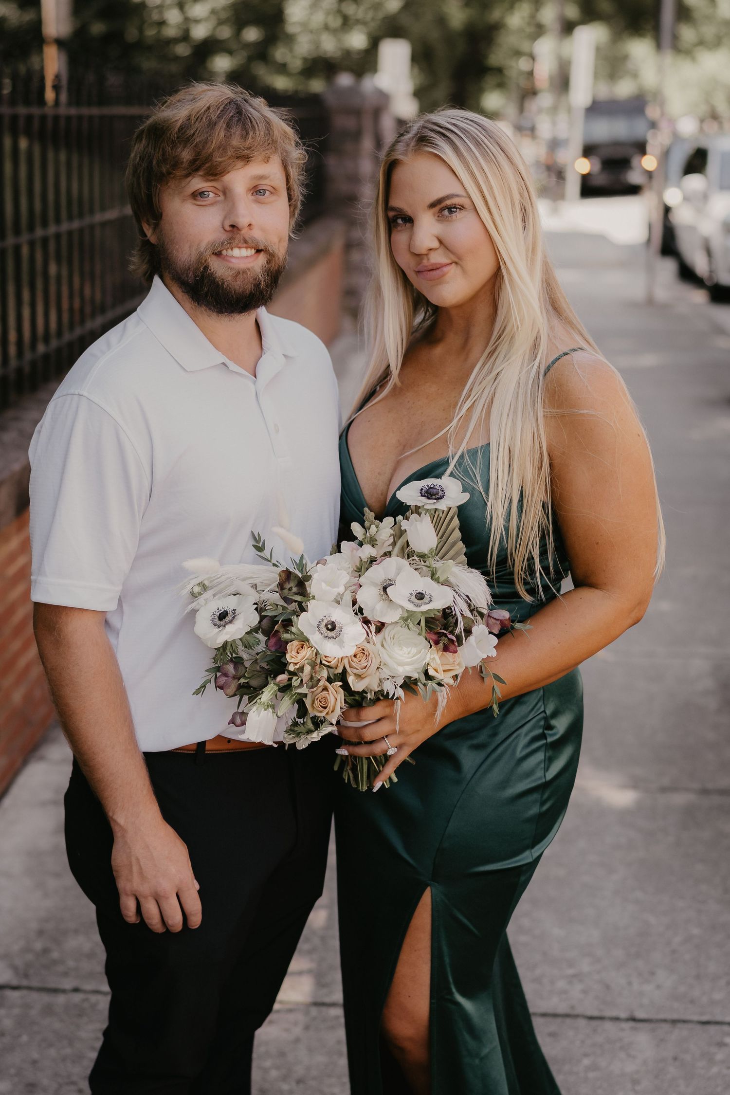 bride & groom holding flowers outside alcoa courthouse