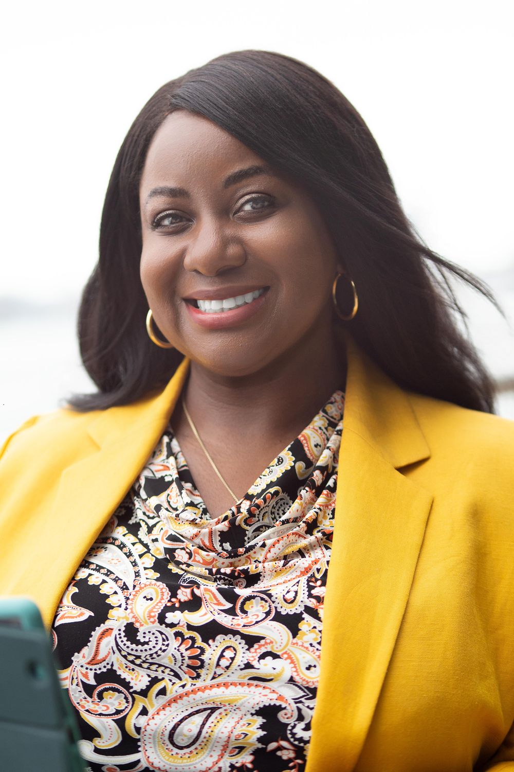 Personal branding photo of an entrepreneur looking at the camera  while working on a computer | Northern NJ branding photographer