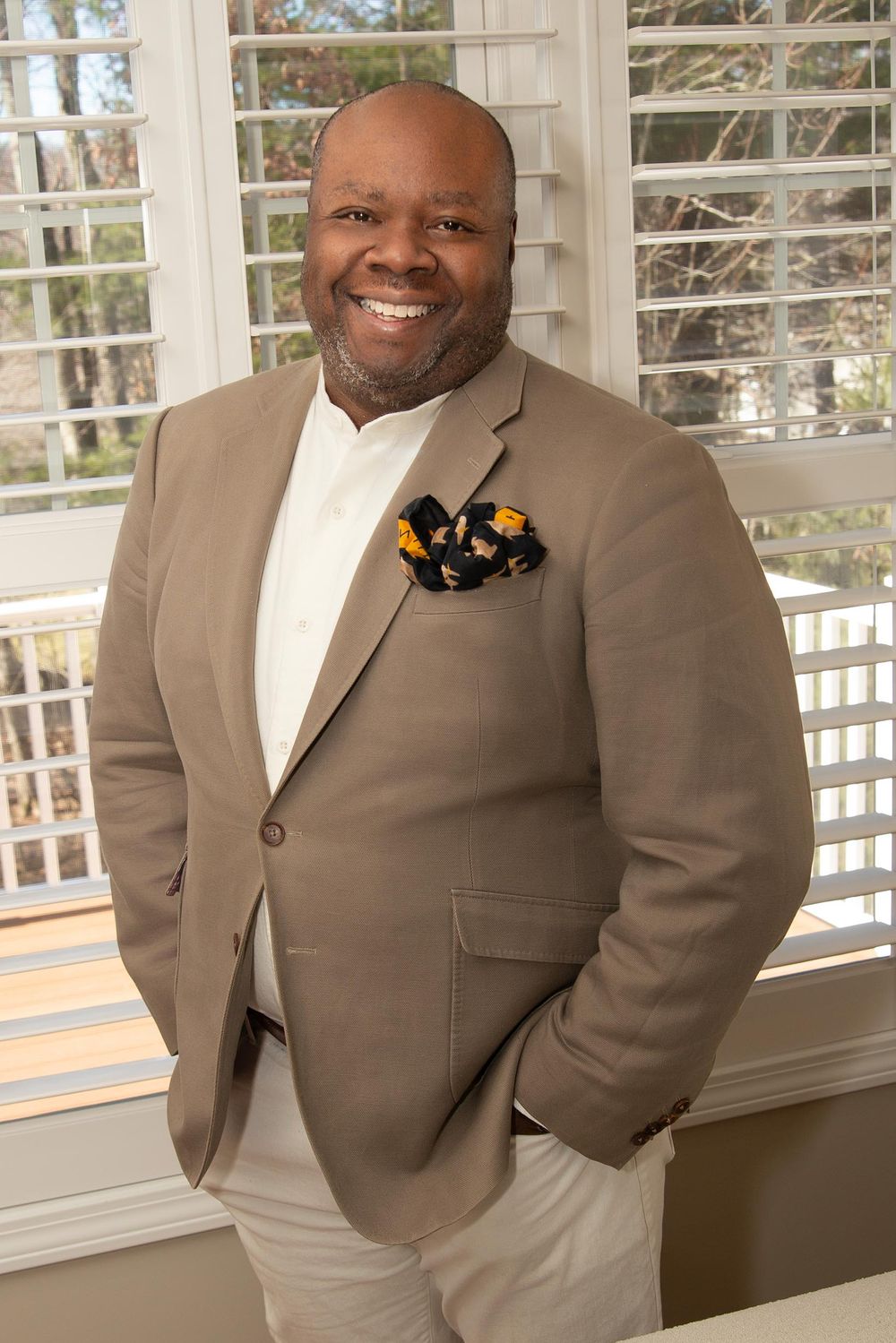 Modern executive portrait with confident expression in a home setting | Northern New Jersey branding photographer