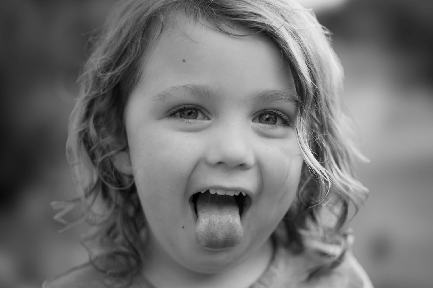 silly boy goofing off at a family photo session on the space coast of florida outdoors