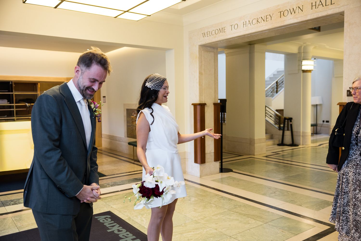 bride and groom arriving at hackney town hall