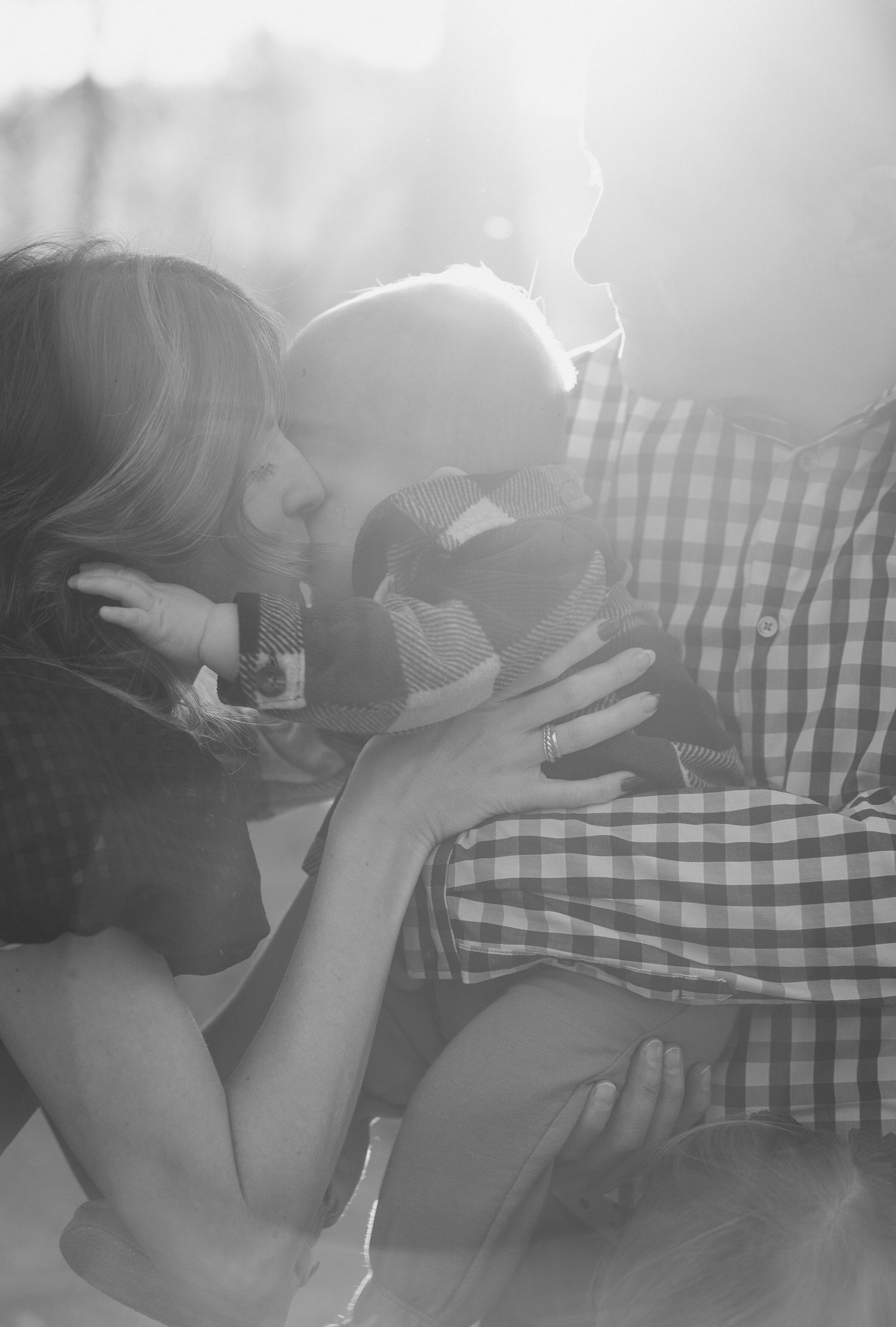 Black and white intimate portraits showing tender moments between a couple.
